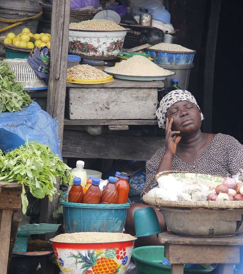 A market trader at her produce stall