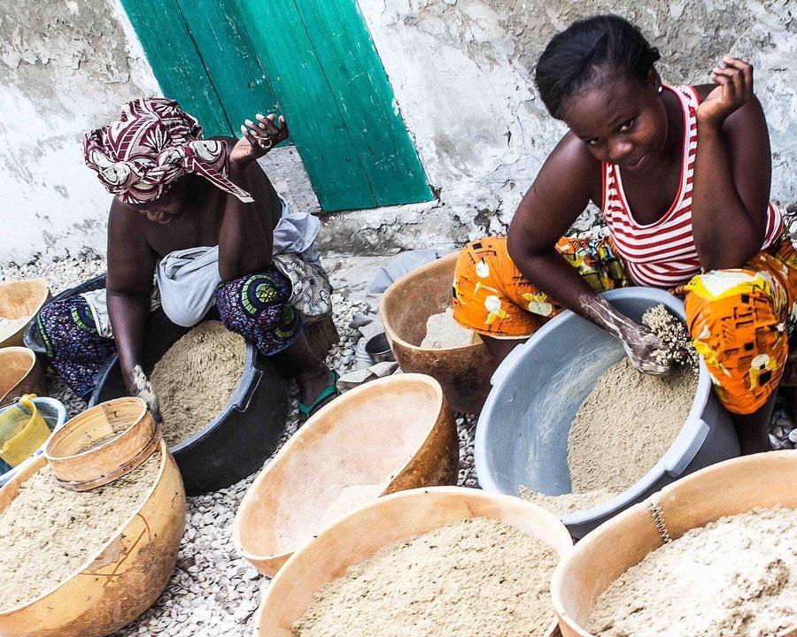 Grain being sorted and winnowed by hand