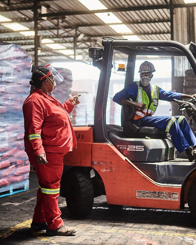 Palletised stock being loaded in a distribution warehouse